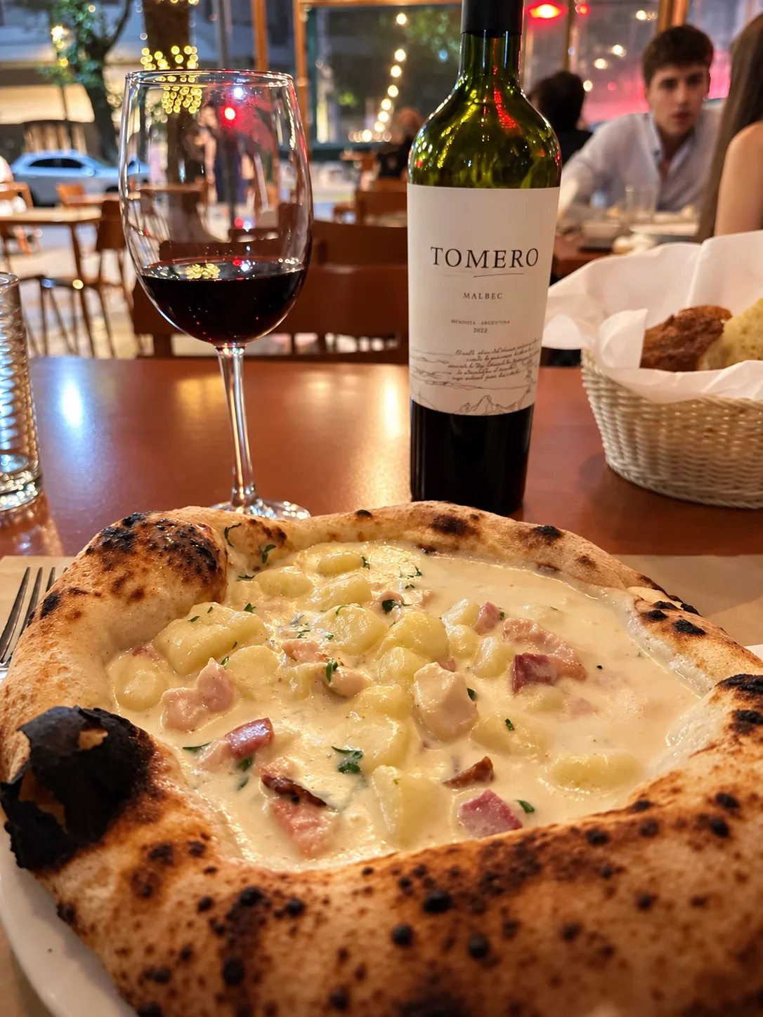 Gnocchi served in pizza bread at Il Bruno in Buenos Aires