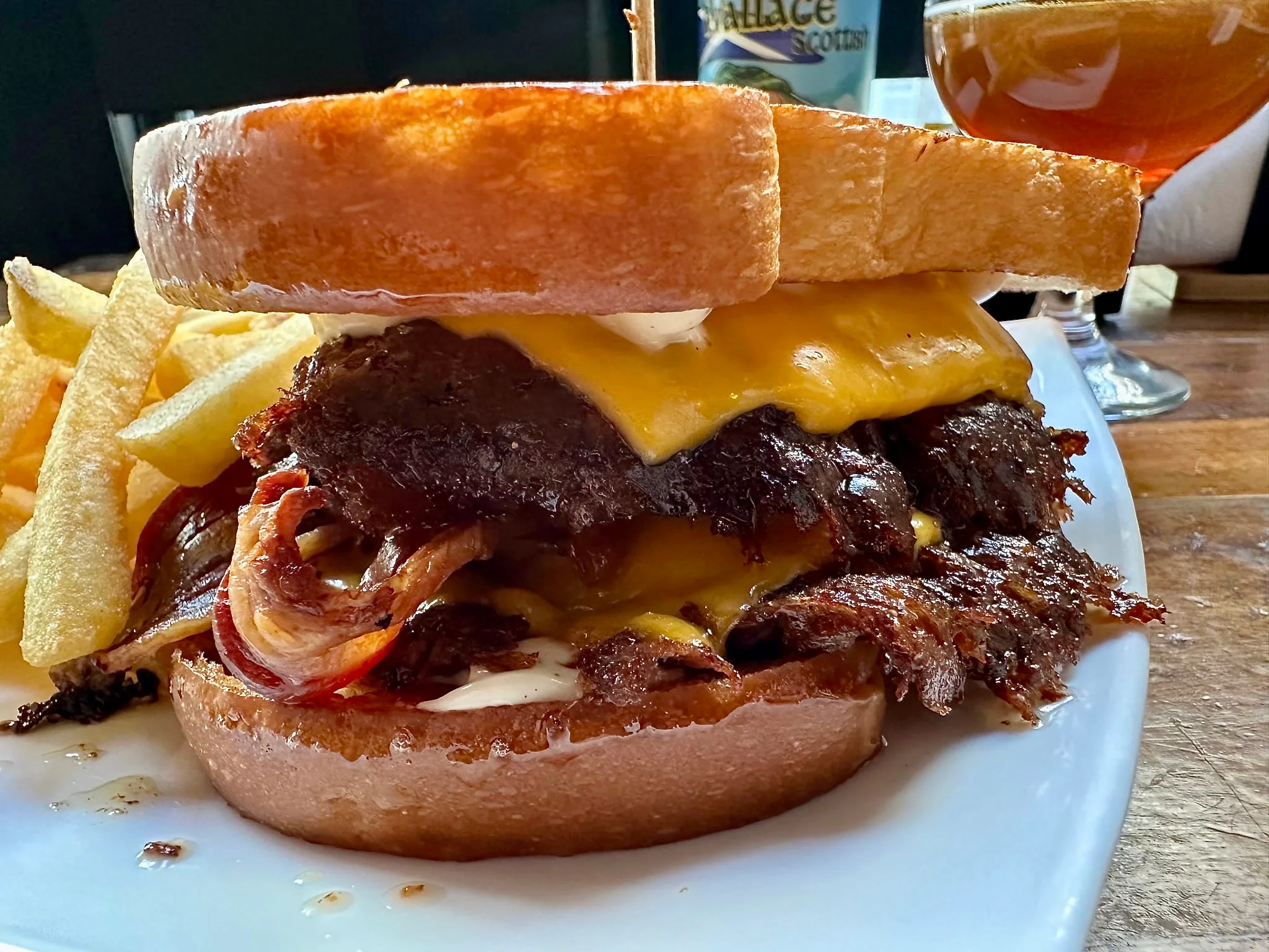 Patty Melt Bacon with crisp beef edges, melted cheddar and golden potato bread at The Flour Store