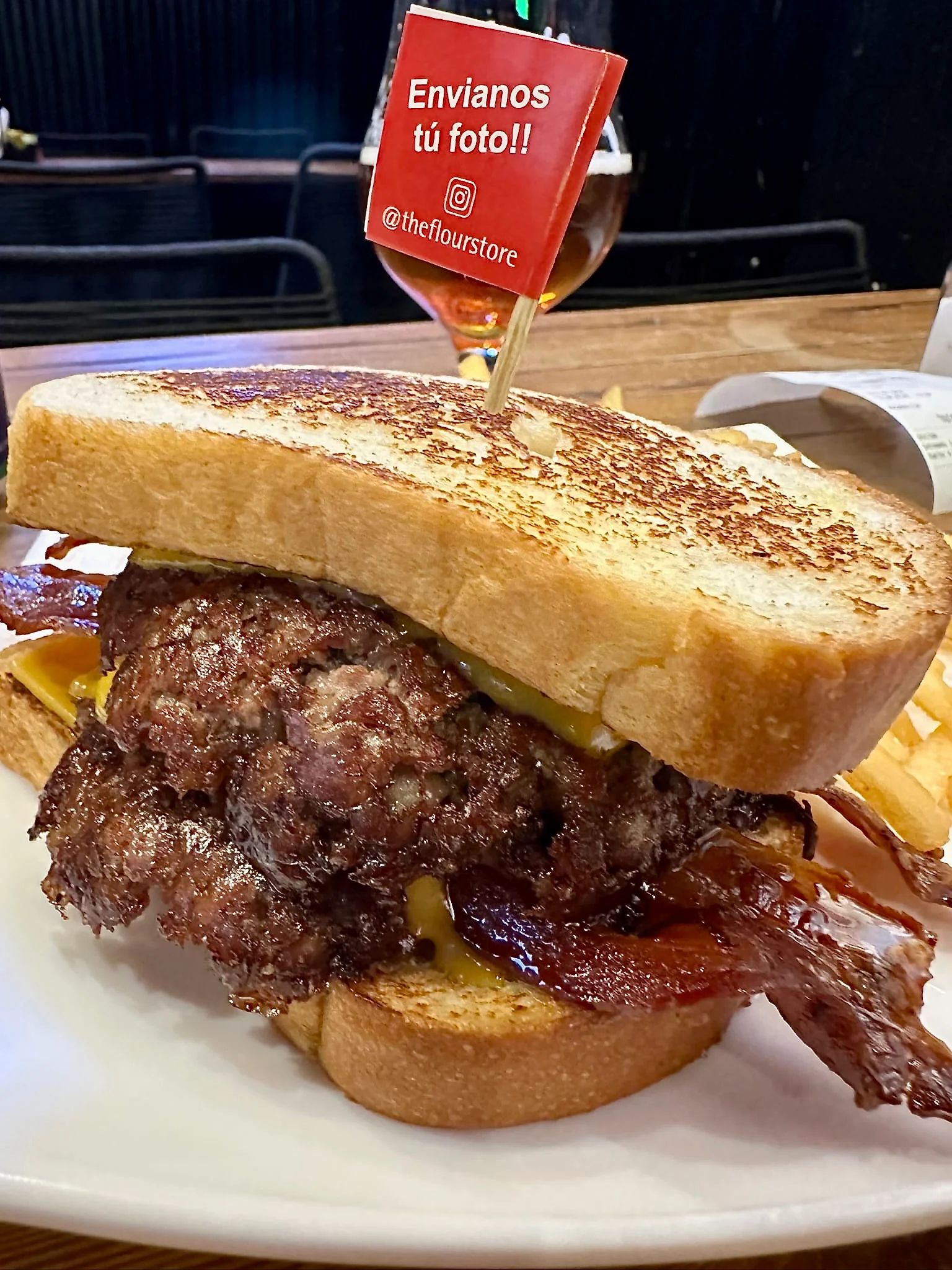 Patty Melt Bacon with crisp beef edges, melted cheddar and golden potato bread at The Flour Store